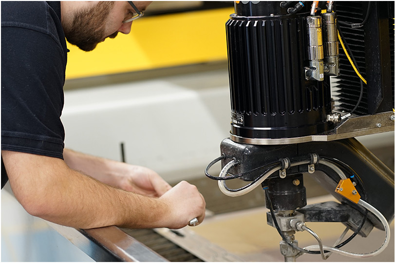 Man Fixing - TECHNI Waterjet
